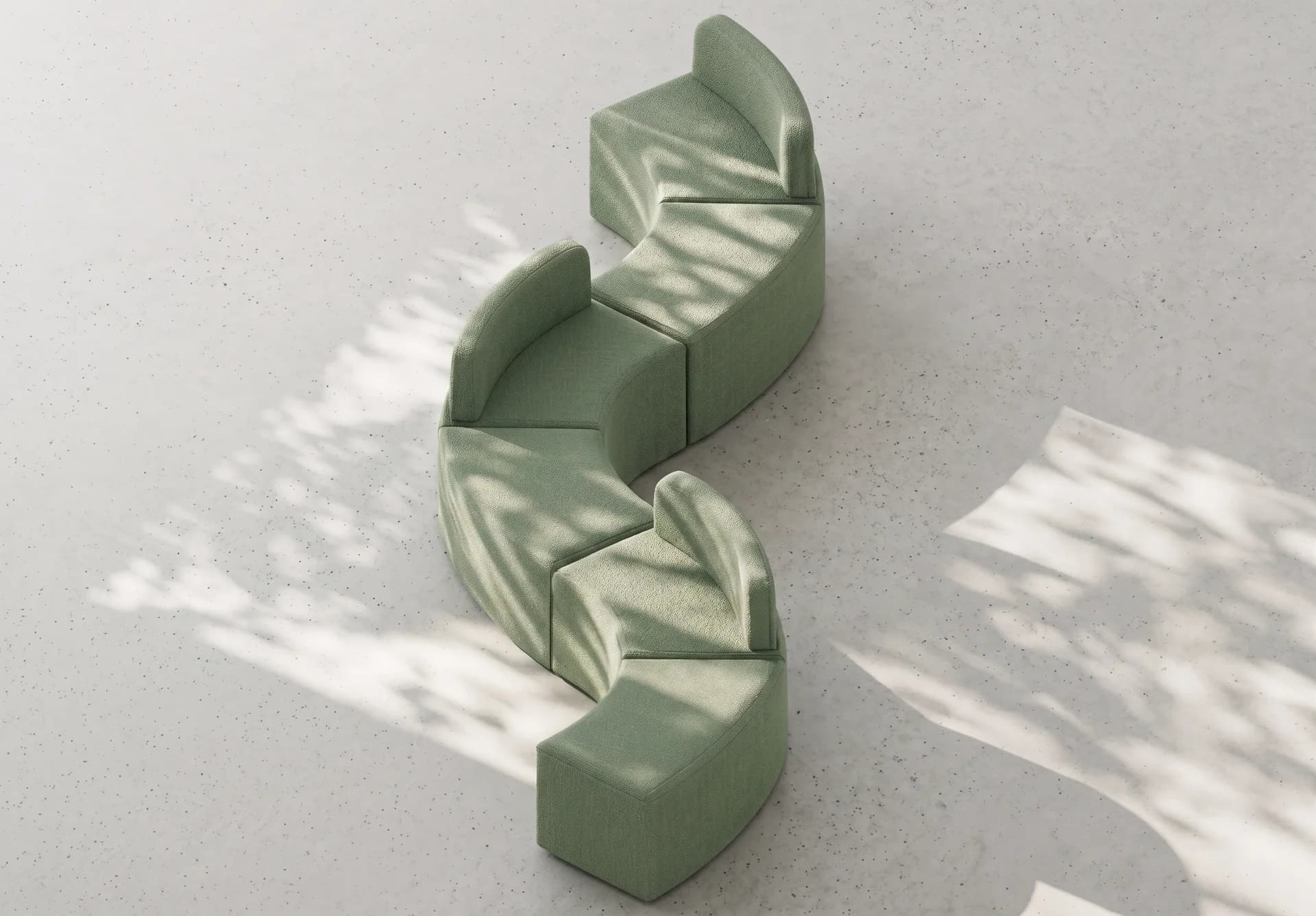 Bancas modulares curvas de Poliarte en tapiz verde, vista cenital